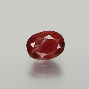 Andesina labradorita vermelho natural 1,36ct, corte oval, translúcido