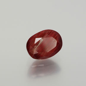 Andesina labradorita vermelho natural 1,36ct, corte oval, translúcido