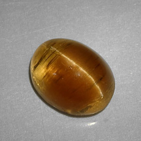 Cat's eye apatite amarelo natural 3,32ct, corte oval, translúcido