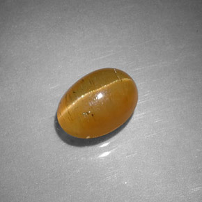 Apatita olho de gato laranja natural 1,43ct, corte oval, translúcido