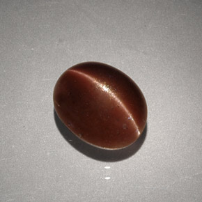 Cat's eye scapolite marrom natural 2,56ct, corte oval, opaco
