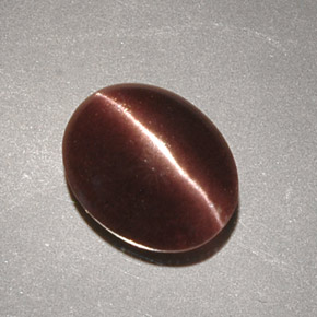 Cat's eye scapolite marrom natural 2,32ct, corte oval, opaco
