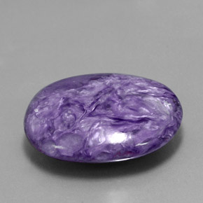 Charoíta violeta natural 26,05ct, corte oval, opaco