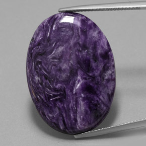 Charoíta violeta natural 23,69ct, corte oval, opaco