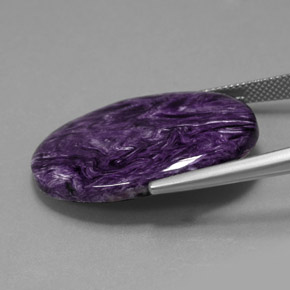 Charoíta violeta natural 23,69ct, corte oval, opaco