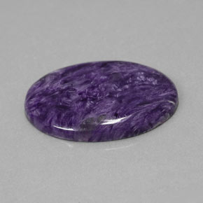 Charoíta violeta natural 23,93ct, corte oval, opaco