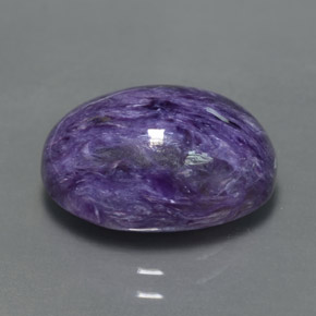 Charoíta violeta natural 6,72ct, corte oval, opaco