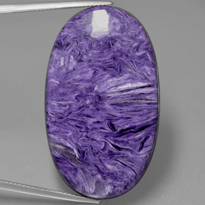Charoíta violeta natural 53,84ct, corte oval, opaco