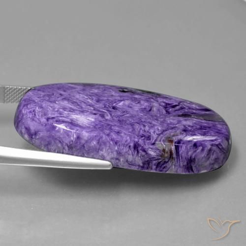Charoíta violeta natural 55,43ct, corte oval, opaco