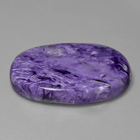 Charoíta violeta natural 84,93ct, corte oval, opaco