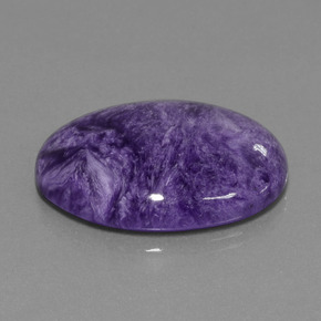 Charoíta violeta natural 34,37ct, corte oval, opaco