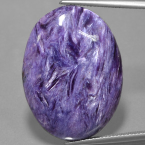 Charoíta violeta natural 31,73ct, corte oval, opaco
