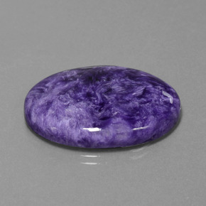 Charoíta violeta natural 27,61ct, corte oval, opaco