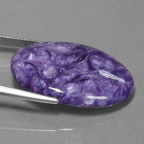 Charoíta violeta natural 28,06ct, corte oval, opaco