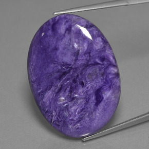 Charoíta violeta natural 30,48ct, corte oval, opaco