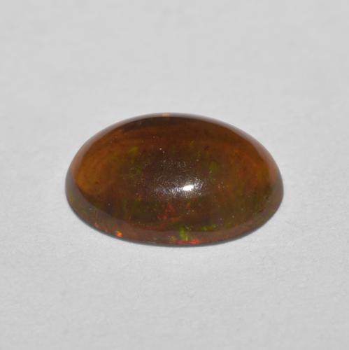 Opala chocolate multicolorido natural 0,57ct, corte oval, translúcido