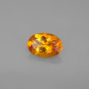 Clinohumita laranja natural 0,67ct, corte oval, VS