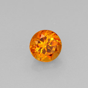Clinohumita laranja natural 0,64ct, corte redondo, VS