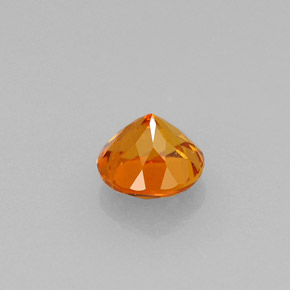 Clinohumita laranja natural 0,64ct, corte redondo, VS