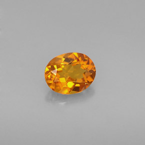 Clinohumita laranja natural 0,54ct, corte oval, VVS-VS