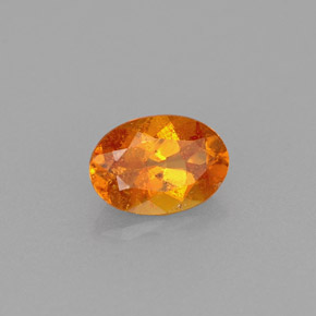 Clinohumita laranja natural 0,56ct, corte oval, VS-SI