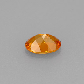 Clinohumita laranja natural 0,56ct, corte oval, VS-SI