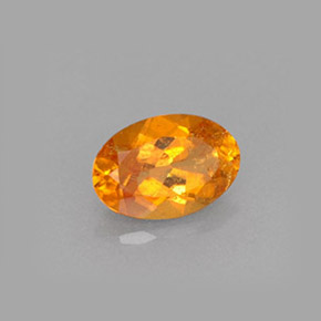 Clinohumita laranja natural 0,61ct, corte oval, VS-SI
