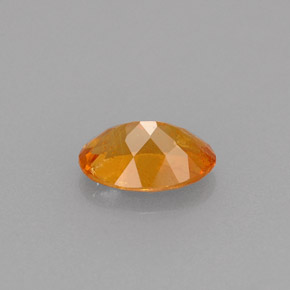 Clinohumita laranja natural 0,61ct, corte oval, VS-SI