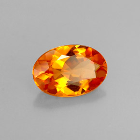 Clinohumita laranja natural 0,58ct, corte oval, VS
