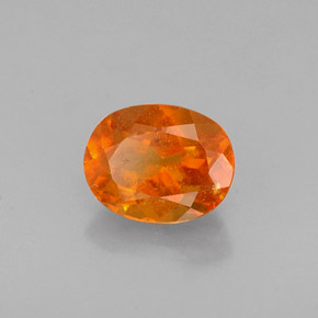 Clinohumita laranja natural 0,72ct, corte oval, VS-SI