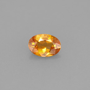 Clinohumita laranja natural 0,42ct, corte oval, VS