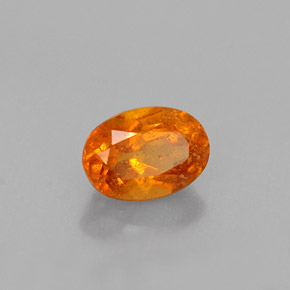 Clinohumita laranja natural 0,52ct, corte oval, VS-SI