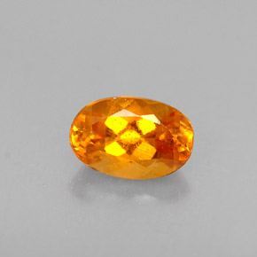 Clinohumita laranja natural 0,47ct, corte oval, VS-SI
