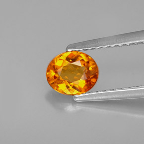 Clinohumita laranja natural 0,54ct, corte oval, VS