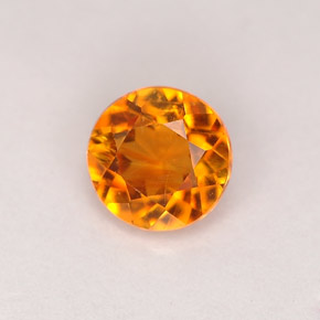 Clinohumita amarelo alaranjado natural 0,68ct, corte redondo, VS-SI