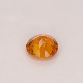 Clinohumita laranja natural 0,46ct, corte redondo, SI