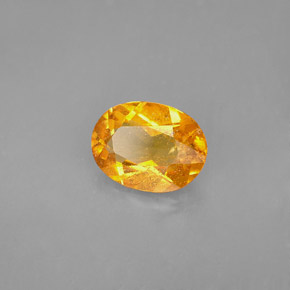 Clinohumita laranja natural 1,68ct, corte oval, VS-SI