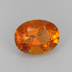 Clinohumita laranja natural 1,43ct, corte oval, VS-SI