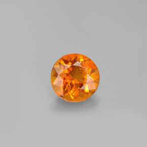 Clinohumita laranja natural 0,77ct, corte redondo, VS-SI