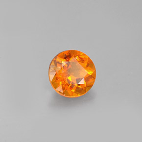Clinohumita laranja natural 0,77ct, corte redondo, VS-SI