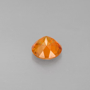 Clinohumita laranja natural 0,77ct, corte redondo, VS-SI