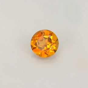 Clinohumita amarelo alaranjado natural 0,52ct, corte redondo, VS