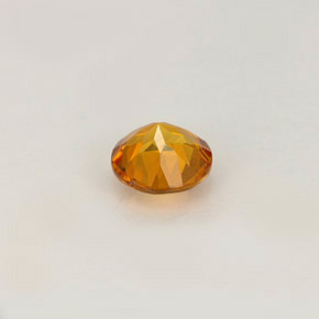 Clinohumita amarelo alaranjado natural 0,52ct, corte redondo, VS