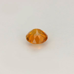 Clinohumita amarelo alaranjado natural 0,46ct, corte redondo, VS