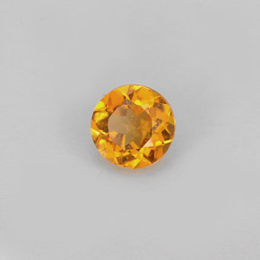Clinohumita laranja natural 0,59ct, corte redondo, VS-SI