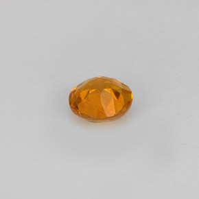 Clinohumita laranja natural 0,59ct, corte redondo, VS-SI