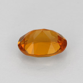 Clinohumita laranja natural 0,84ct, corte oval, VS-SI