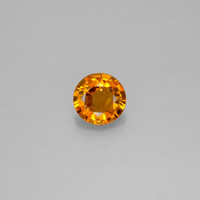 Clinohumita laranja natural 0,57ct, corte redondo, SI