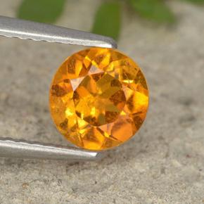 Clinohumita Amarelo alaranjado Natural 0.87ct, Corte Redondo, VS-SI