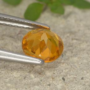 Clinohumita laranja natural 0,75ct, corte redondo, VS-SI